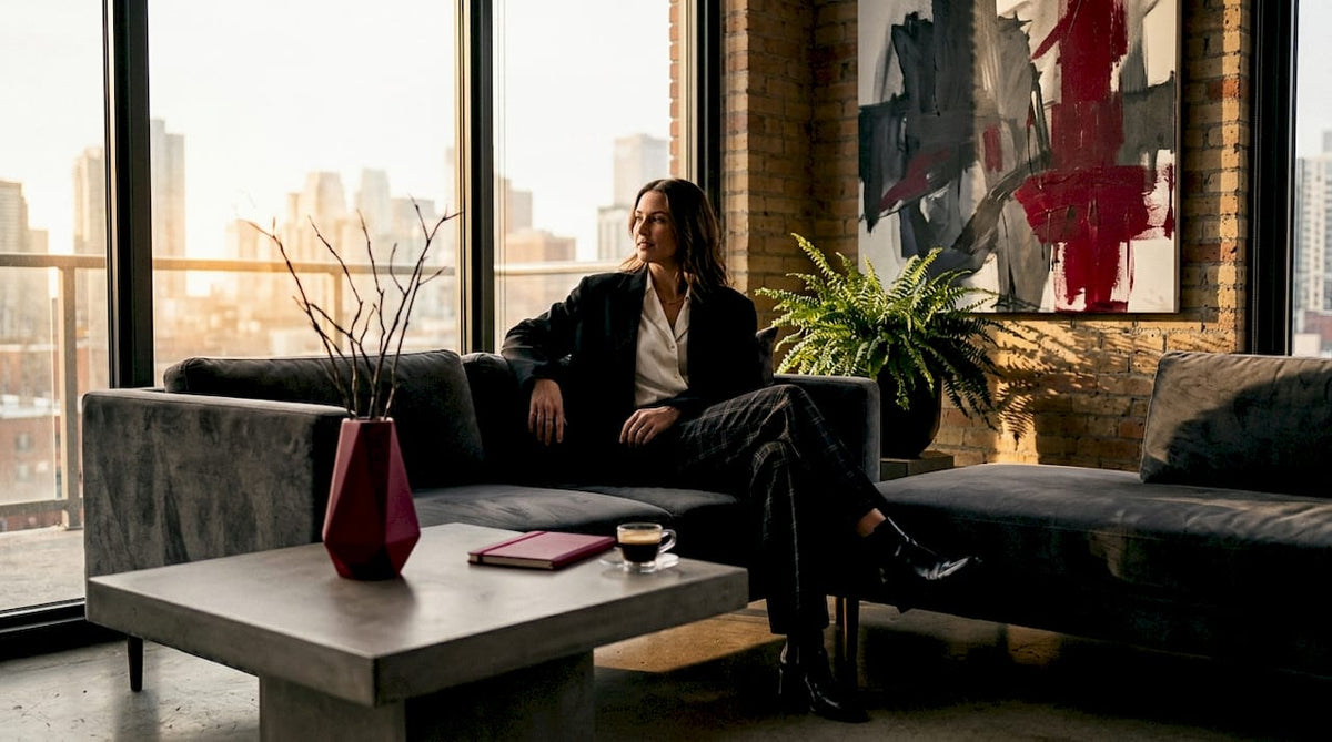 Woman in smart casual outfit relaxing in living room